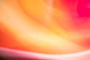 Abstract background of waves in red tones. Backdrop for web design, packaging, advertising. photo