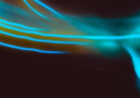 Abstract background. Neon rays from nightclub lamps.