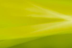 Abstract mustard green horizontal background made of bends, waves and highlights. photo