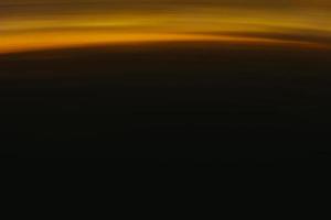 Abstract orange sunset on the dark horizon. Beautiful background. photo