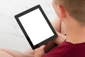 Man sitting with tablet in hands.Top view.Mock up.Copy space.Template.Blank. photo