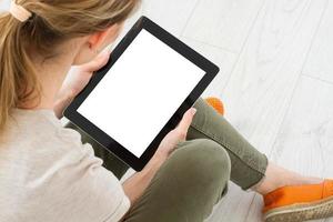 Girl sitting with tablet in hands Online shopping.Top view.Mock up.Copy space.Template.Blank. photo