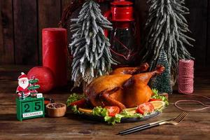 Tasty fresh baked turkey with spices and herbs for a family holiday table photo