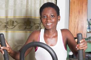 Training a young woman in a gym. photo