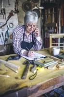 Female carpenter in his workshop photo