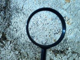 Close up image of magnifying glass or lupe photo