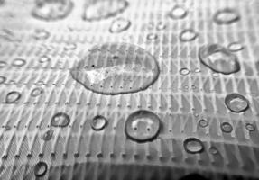 Water drop on fabric textured surface photo