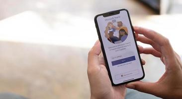 A working from home employee is downloading the Microsoft Teams social platform, ready for remote working in isolation from home photo