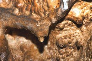 Detail of stalactite in underground limestone caves photo