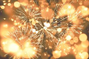 Abstract background. Gold-colored blur. Fireworks circle blur photo