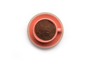 Ground coffee powder in cup isolated on a white background. photo