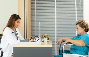 Female doctors perform disease tests and provide medical advice to senior patients that treatment. photo