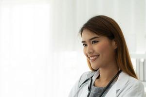 The female doctor with a smiling face happily. photo