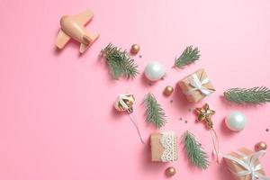 wooden children's plane on a pink background photo