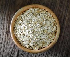 Rolled oats on a wooden table photo