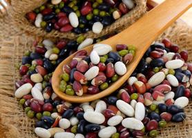 grains mix beans in wood spoon photo