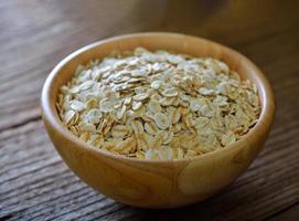 Rolled oats on a wooden table photo