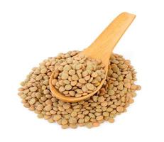 lentils in wood spoon isolated on white background photo
