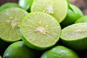 Close up shot of wet limes photo