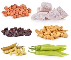 soy bean, Dried raisins, chili pepper, Cashews, slice taro root, peanats on white background photo