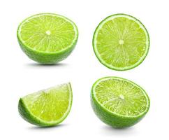 Juicy slice of lime on white background photo