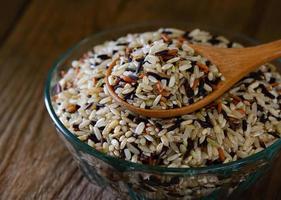 Brown rice seed in bowl. photo