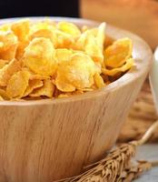 corn flakes in wood bowl photo