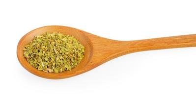 Dried oregano in wood spoon on white background photo