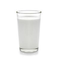 fresh milk in the glass on white background photo