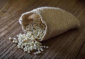 pearl barley in sacks against photo