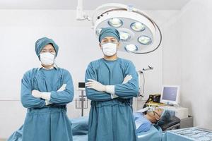 portrait of two surgeons standing in the operating room. Surgery and emergency concept photo