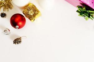 Red ball and gold giftbox christmas decoration on white backgrounds above, Top views photo