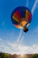 Colorful hot air balloon in blue sky