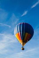 Colorful hot air balloon in blue sky photo