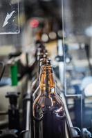 Row of bottles on conveyor photo