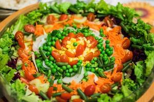 Bowl filled with fresh vegetarian salad. photo