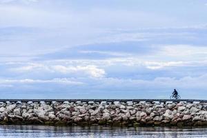 Path over a Rock Pier at the Sunset photo