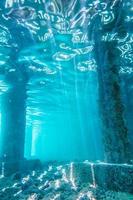 Underwater view of Under a Pier with Pillars and Sun Light photo