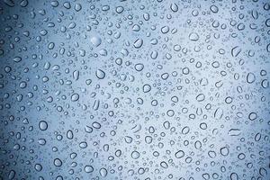 Gotas de lluvia abstractas sobre textura de vidrio foto