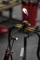 Glassblowing Work Place and Propane Torch Pilot Flame photo