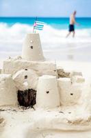 Cuban Sandcastle with the country Flag in Cuba. photo