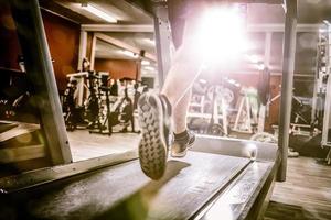 Man running on treadmill photo