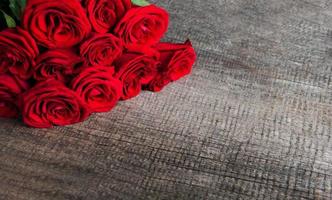 Red roses on a table photo