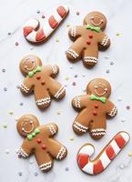 Christmas gingerbread cookies on white marble background photo