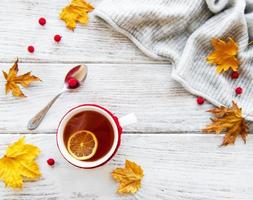 autumn flat lay with cup of tea and leaves photo