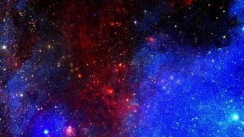 Space exploration through outer space towards glowing orange blue nebula video