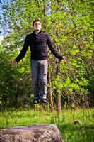 Man floating in the forest photo