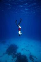 Underwater image of a Freediver with fins photo