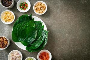 Miang kham - A royal leaf wrap appetizer photo