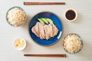 Hainanese chicken rice or rice steamed with chicken soup photo